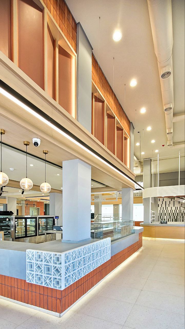 Al Fanar Bakery interior with illuminated terracotta counters and display cases